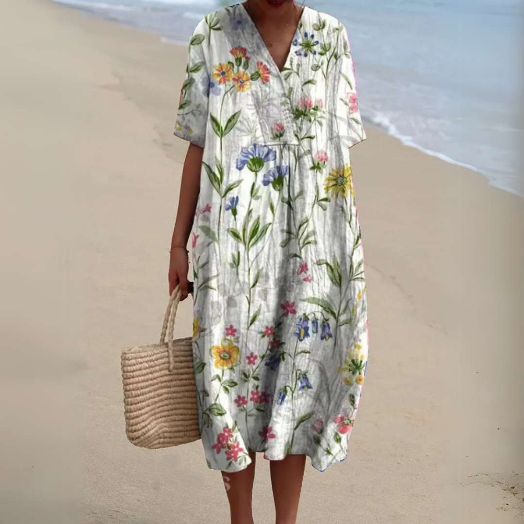 White V-neck midi dress covered in colourful wildflower print