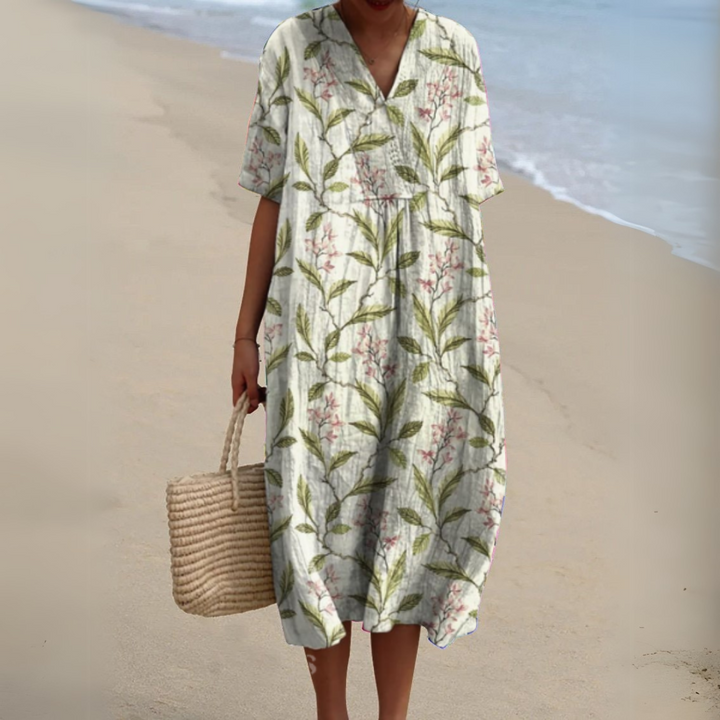 Cream midi dress featuring green leaf and pink blossom print