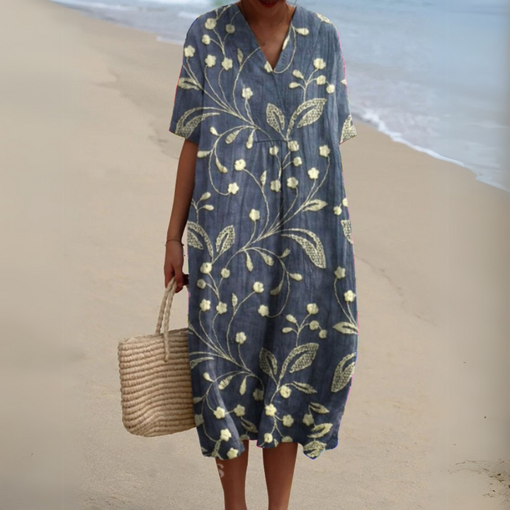 Slate blue V-neck midi dress with pale floral vine detailing