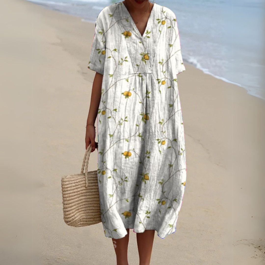 White V-neck midi dress patterned with yellow citrus fruit print