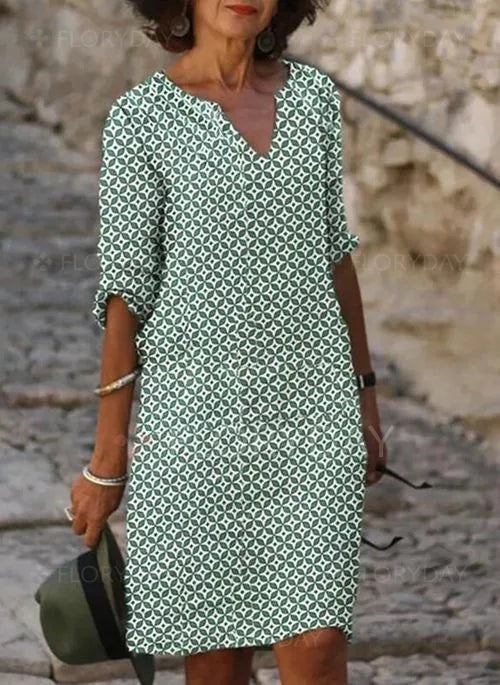 Green geometric print midi dress with notch neckline and roll-up sleeves