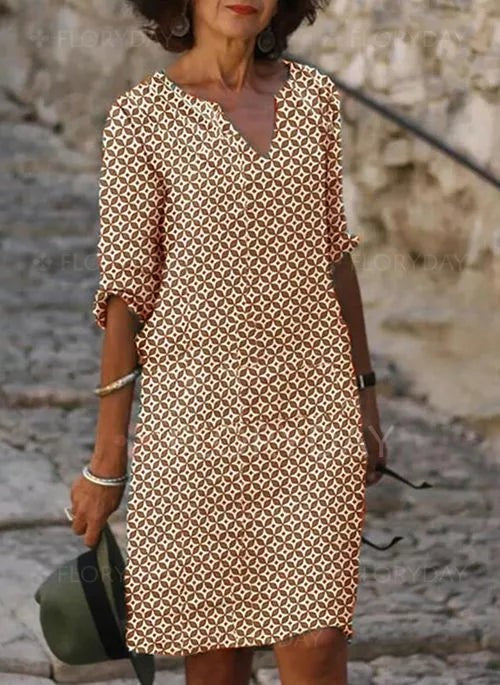 Rust and cream patterned shift dress with notch V-neck and mid sleeves
