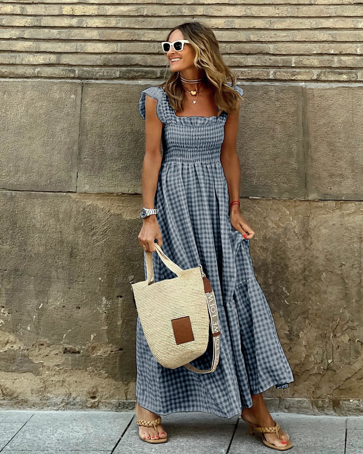 Navy gingham flutter sleeve maxi dress with smocked waist and ruffled straps