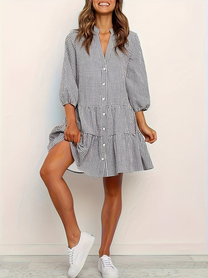 Black and white gingham tiered mini shirt dress with button-front detail