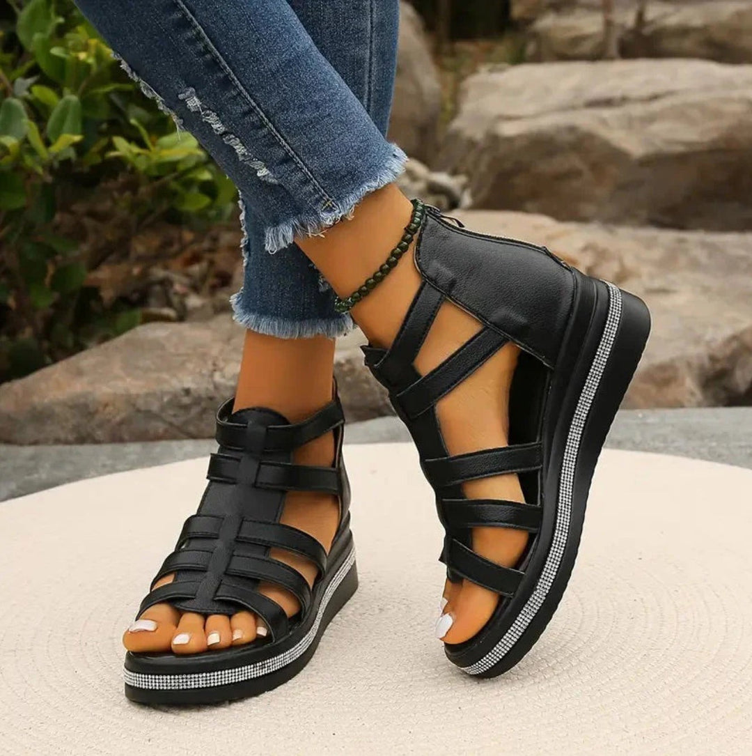 Black gladiator wedge sandals with strappy cage design and diamante trim