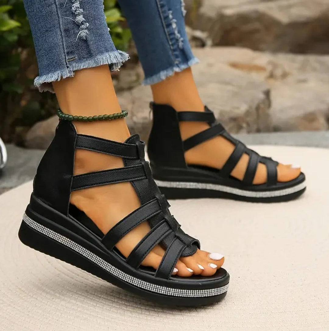 Black strappy gladiator wedge sandals with rhinestone-trimmed platform sole