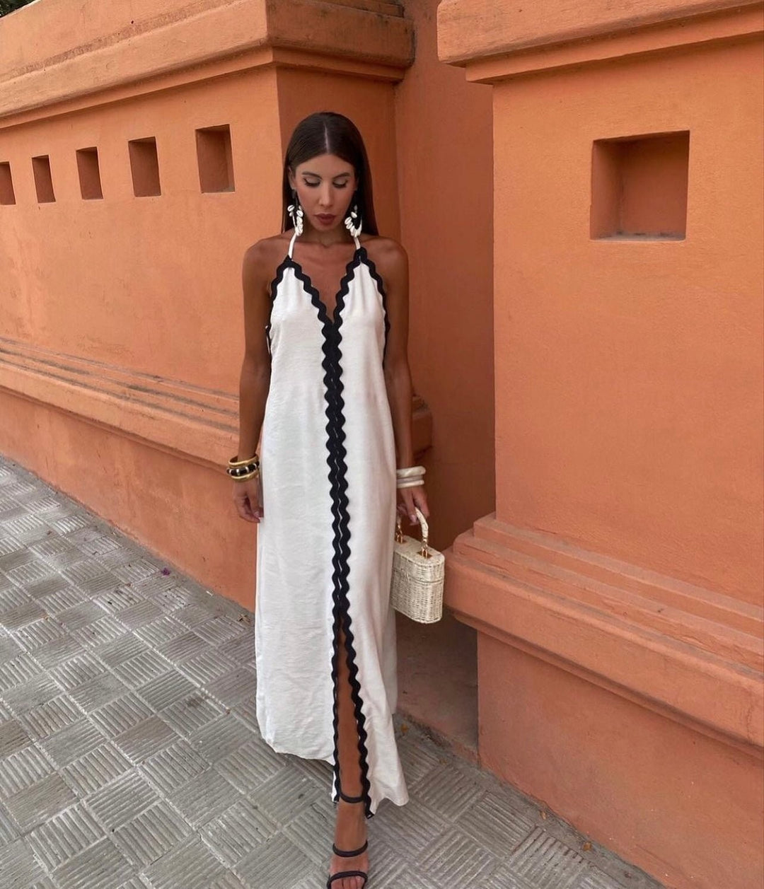 White halterneck maxi dress featuring contrasting black ric-rac trim detail