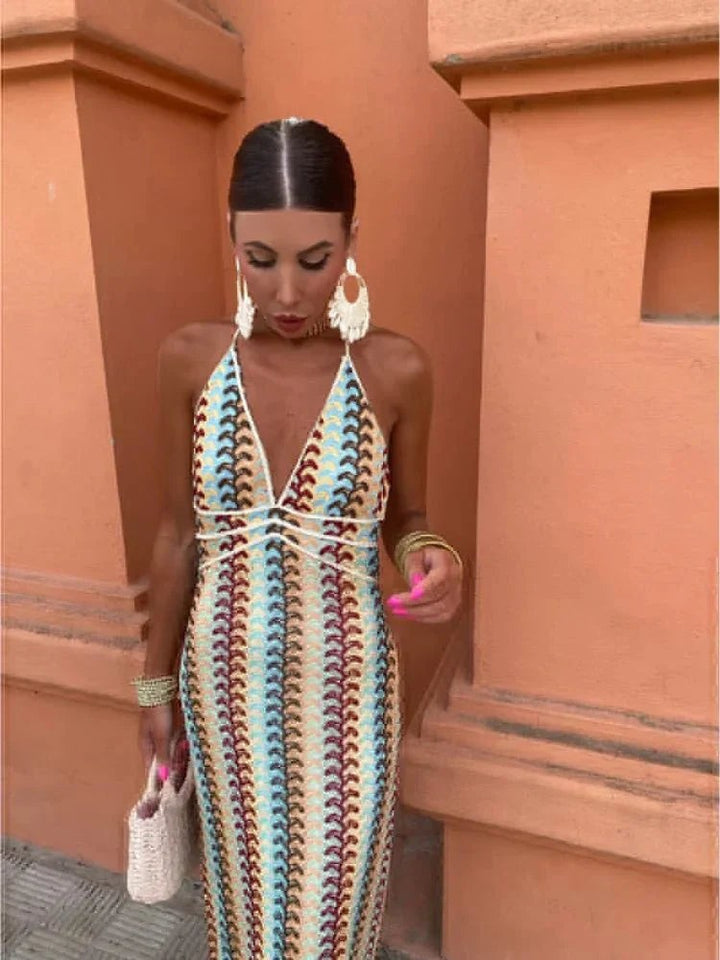 Close-up of plunging halterneck maxi dress in chevron crochet knit pattern