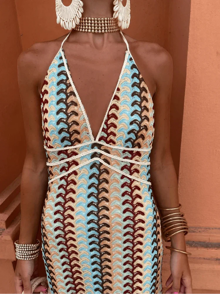 Detailed view of crochet dress bodice with shell choker and drop earrings