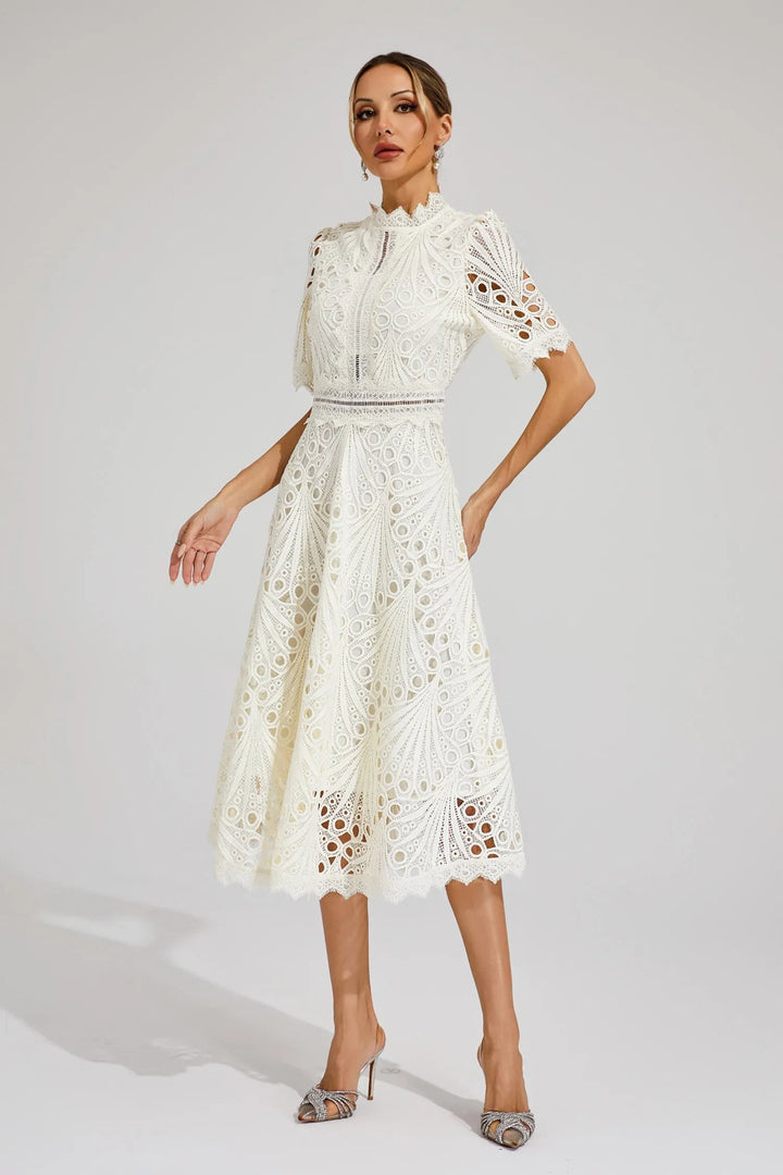 Cream crochet lace dress featuring fitted waist and flared skirt
