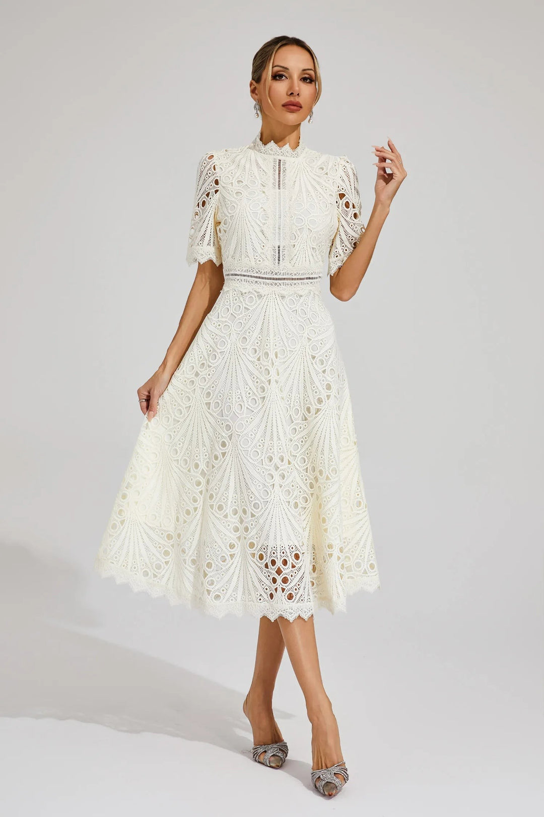 Off-white lace midi dress styled with delicate pearl drop earrings