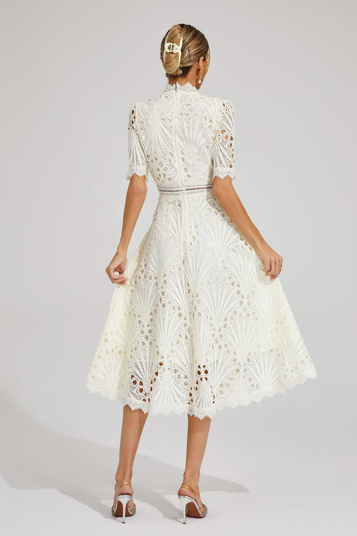 Cream lace midi dress viewed from behind showing full skirt silhouette
