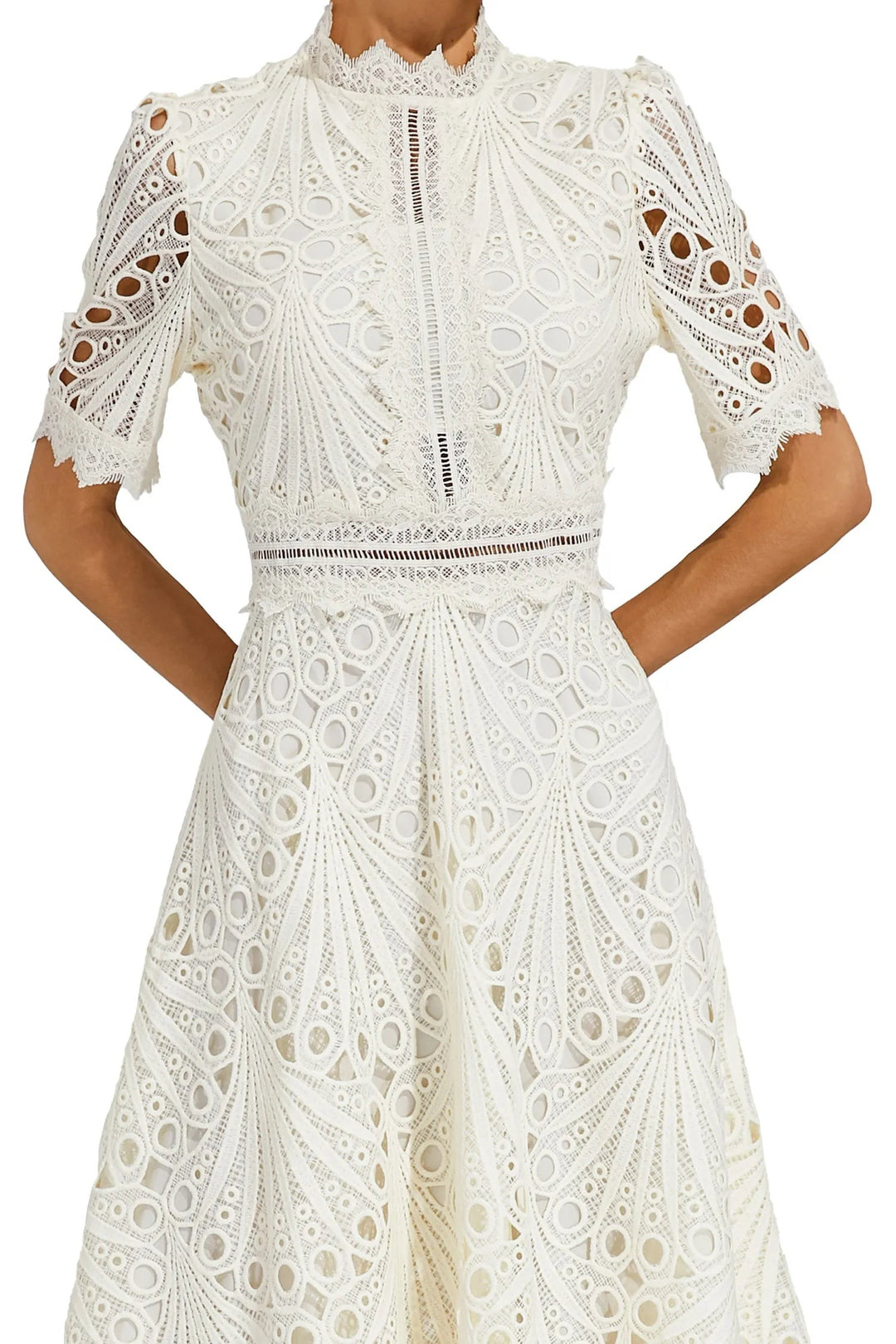 Close-up of ivory lace dress bodice with high neckline and waist trim