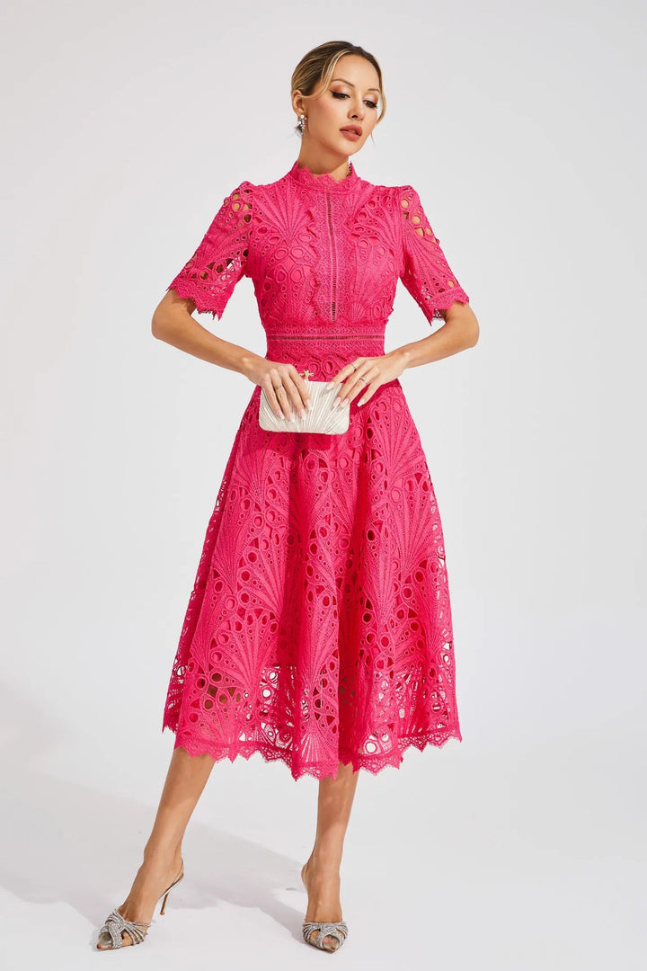 Hot pink crochet lace midi dress worn with a silver clutch bag