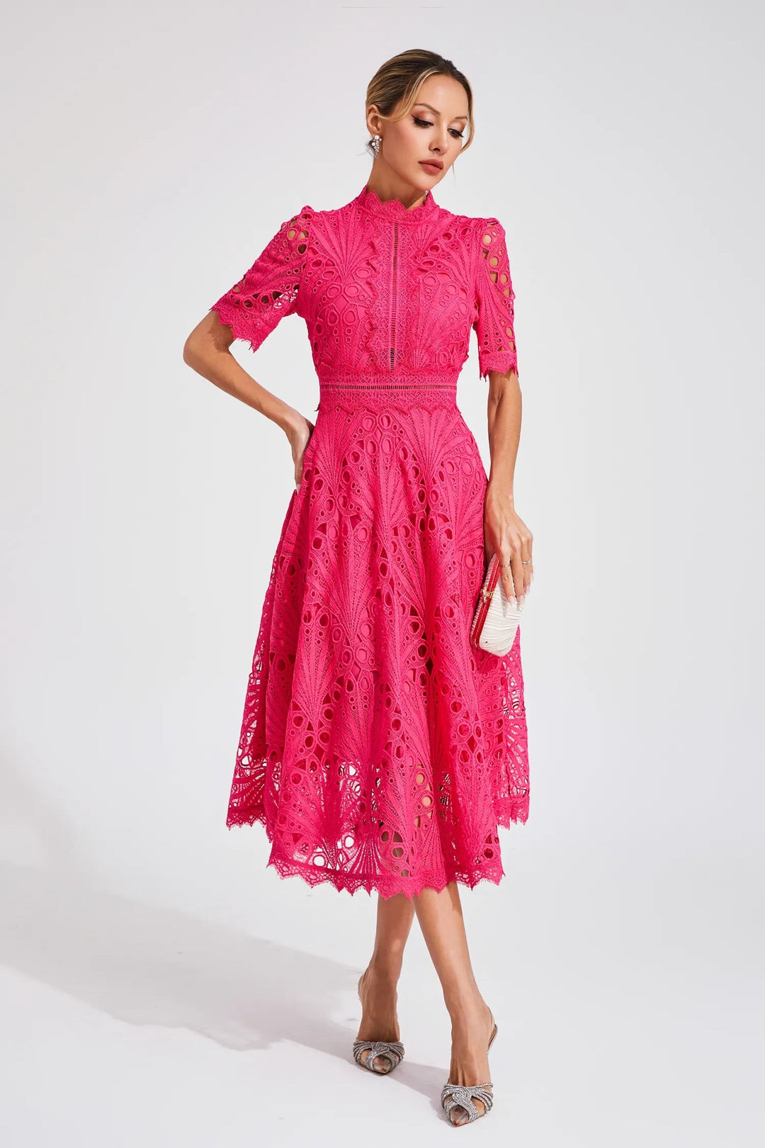Bright pink lace midi dress with intricate fan-patterned cutwork