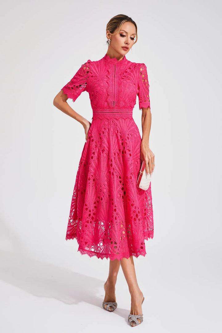 Bright pink lace midi dress with intricate fan-patterned cutwork