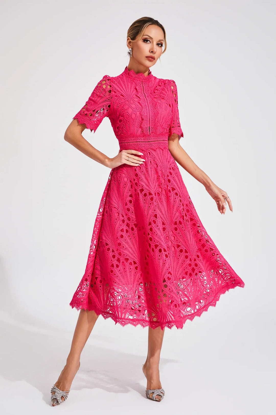 Hot pink lace midi dress paired with strappy diamante heels