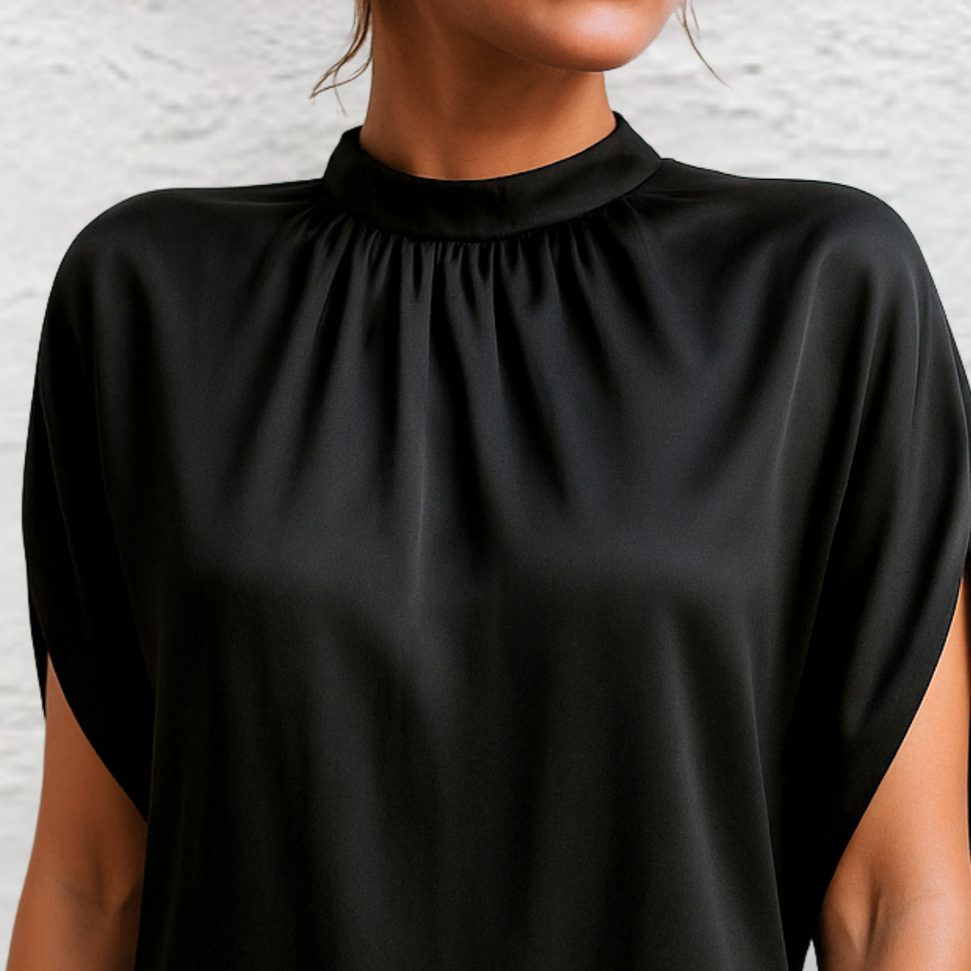 Gathered high neckline detail on black satin mini dress with cap sleeve