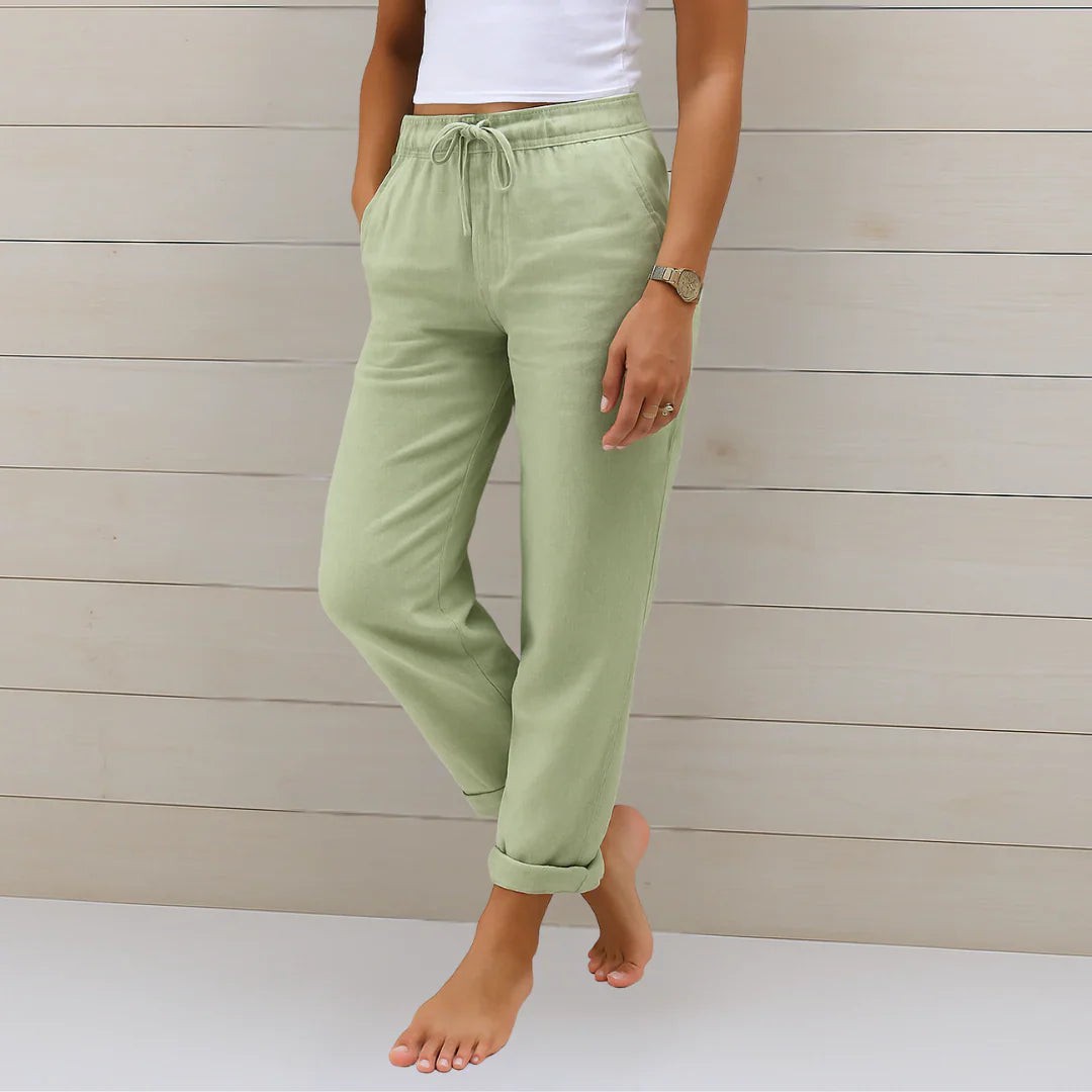 Sage green linen-blend trousers with elasticated drawstring waist and rolled hems