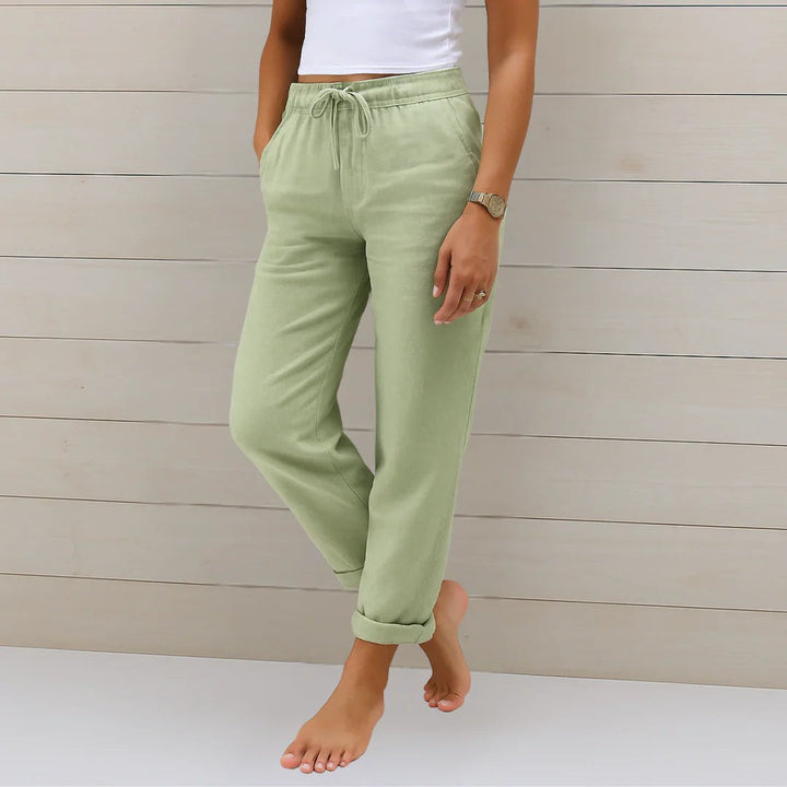 Sage green linen-blend trousers with elasticated drawstring waist and rolled hems