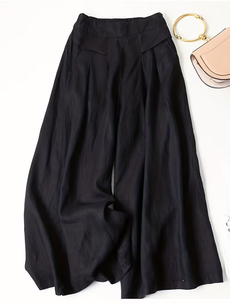 Black wide-leg trousers with pleated waist and elasticated back detailing