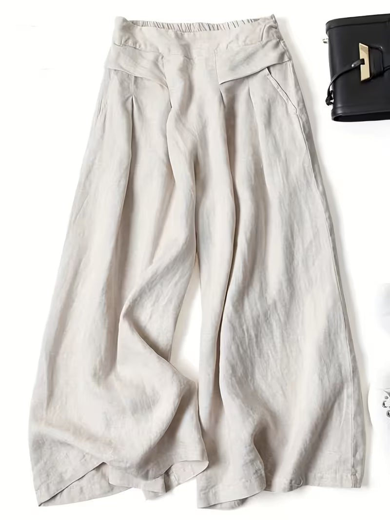 Cream wide-leg linen trousers with pleated front and soft draped fabric