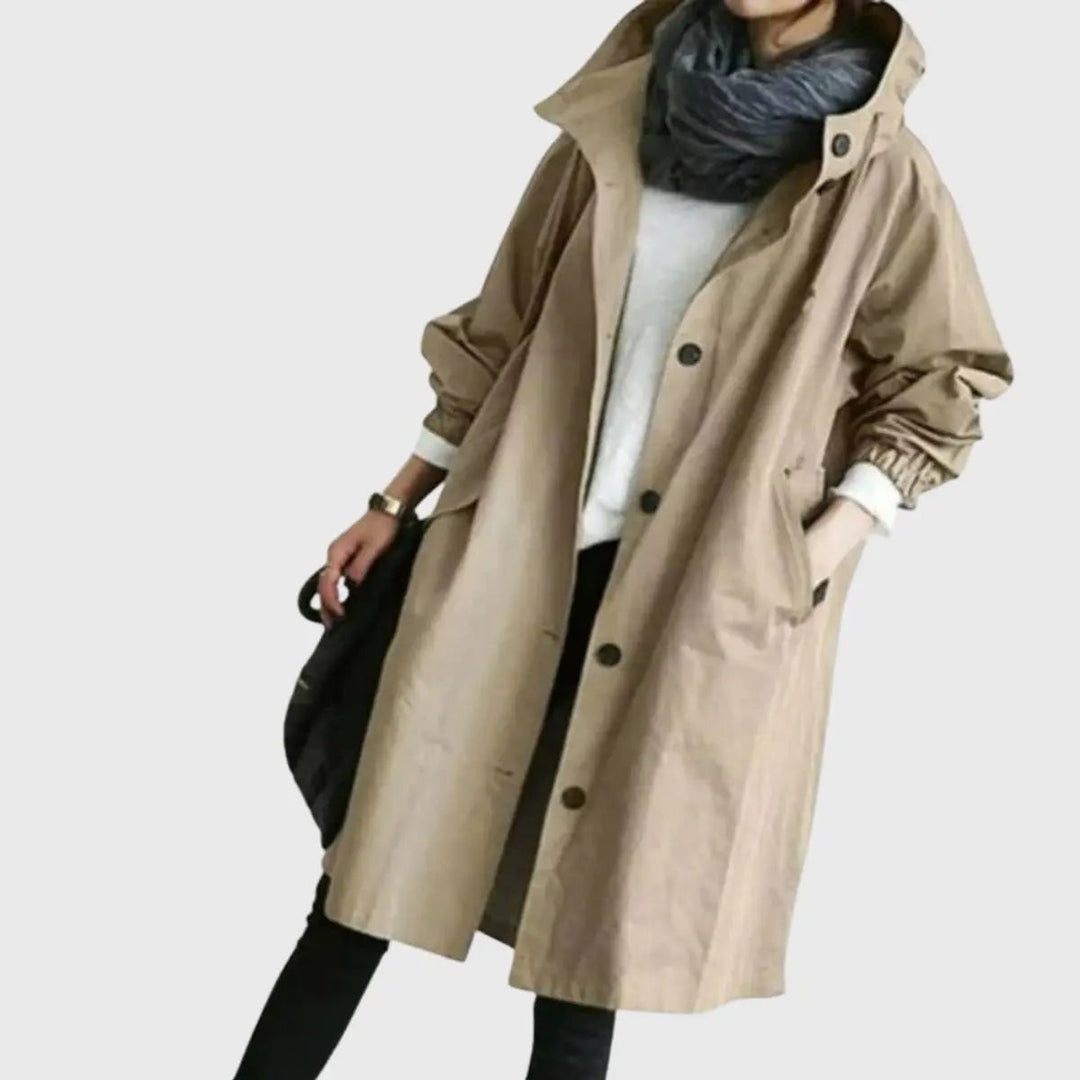 Khaki hooded trench coat with button-front fastening, worn loosely
