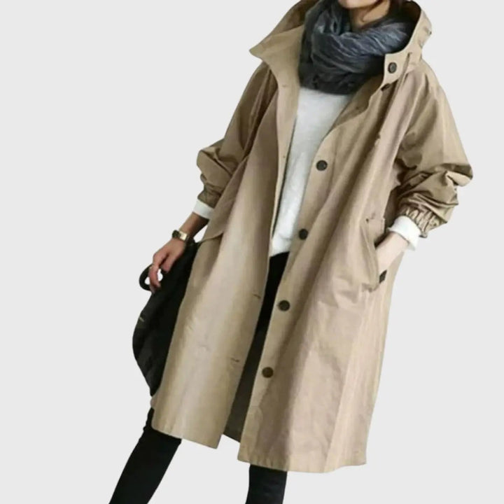 Khaki hooded trench coat with button-front fastening, worn loosely