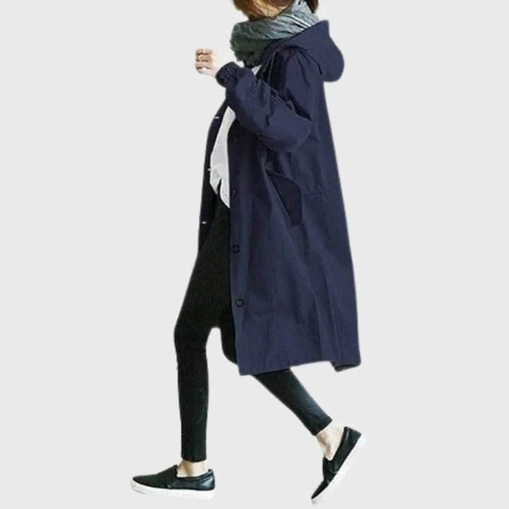 Navy hooded relaxed-fit trench coat with drawstring hood, side profile