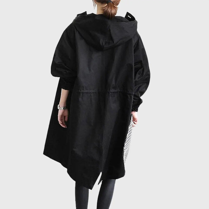 Black hooded waterproof trench coat rear view with asymmetric hemline