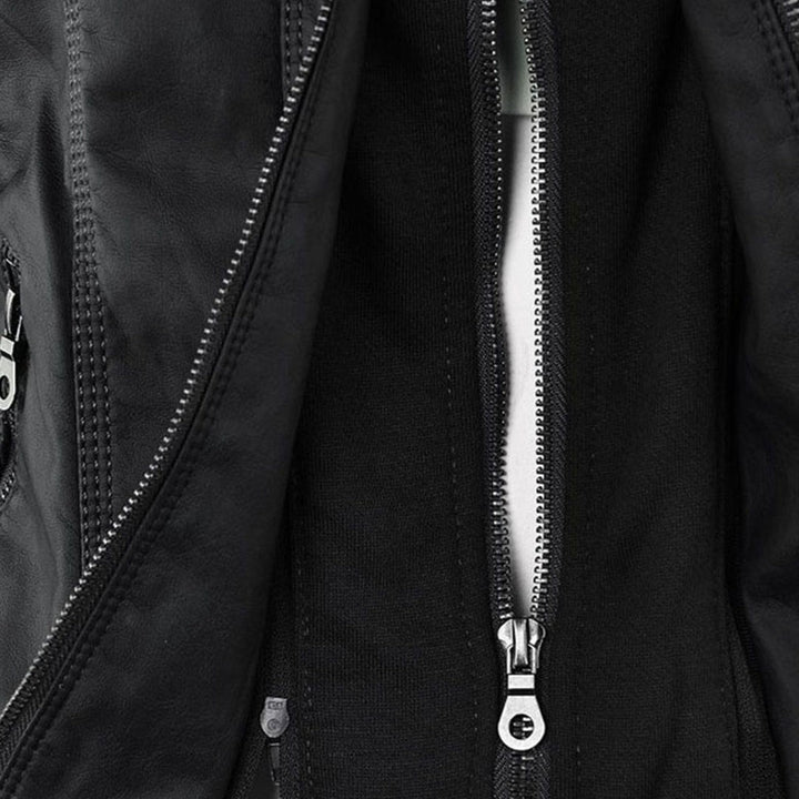 Close-up of black faux-leather jacket zip fastening with jersey underlay