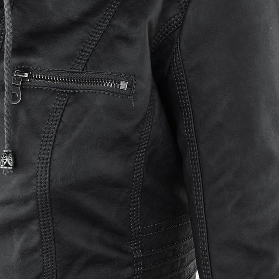 Close-up of black faux-leather jacket pocket zip and braided pull detail