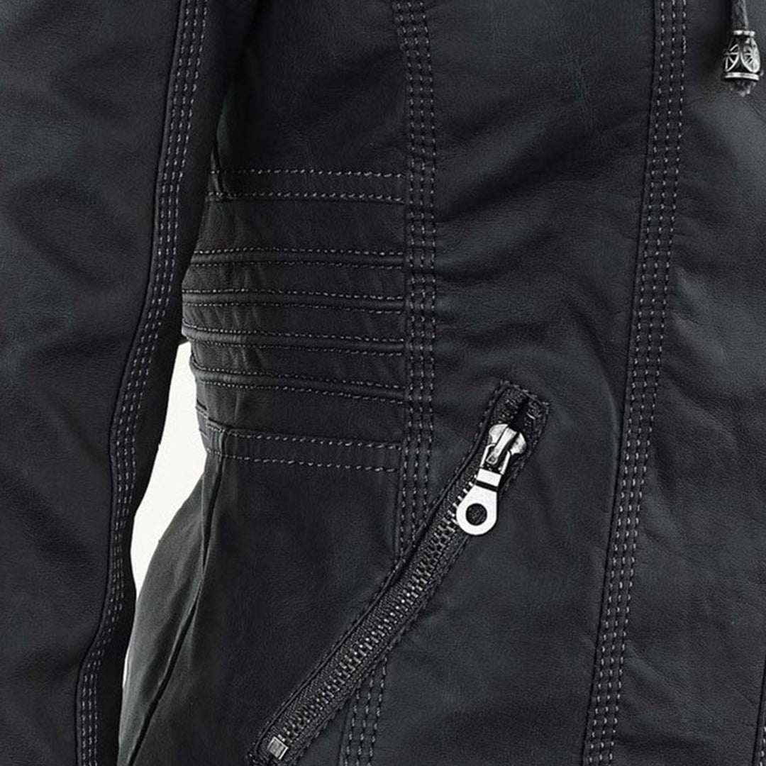 Close-up of black faux-leather jacket seam with quilted panel stitching