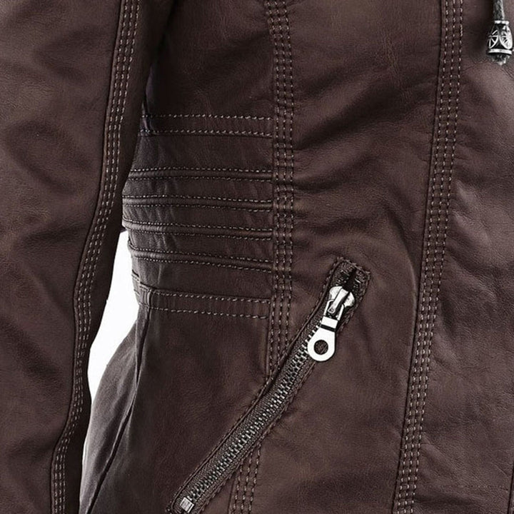 Close-up of brown faux-leather jacket pocket zip with braided pull tag