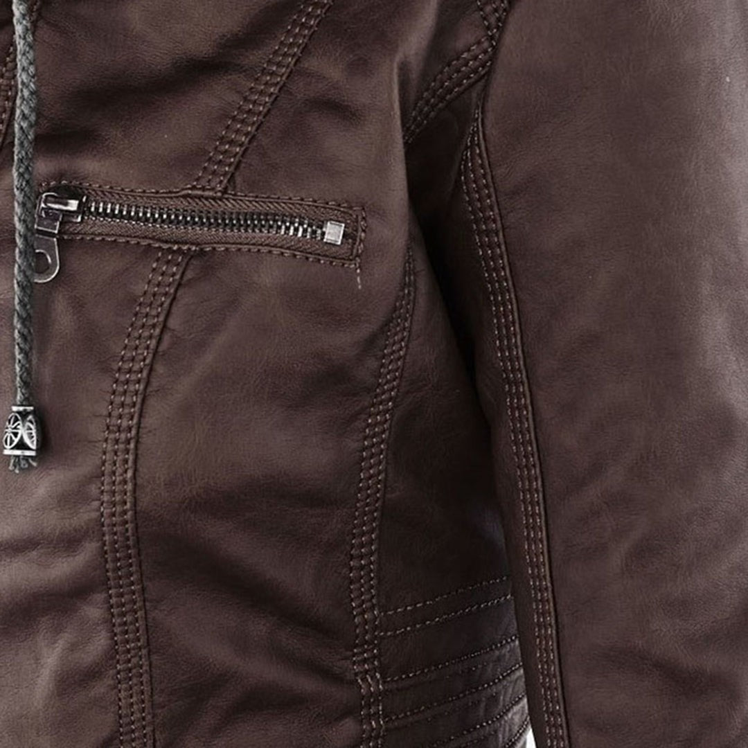 Close-up of brown faux-leather jacket seam showing quilted stitch detail