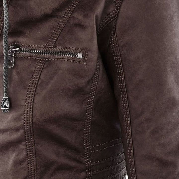 Close-up of brown faux-leather jacket seam showing quilted stitch detail