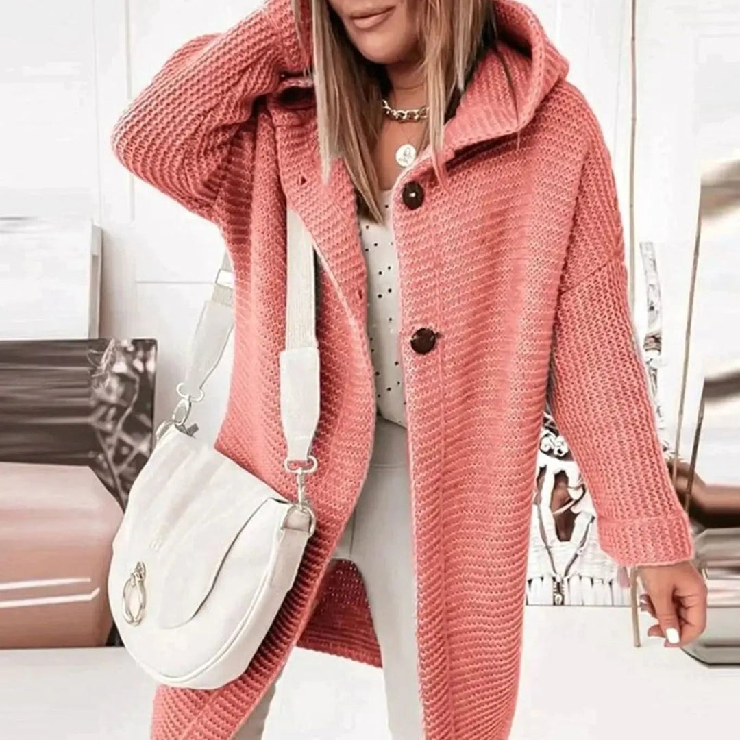 Coral pink chunky knit hooded cardigan featuring button-front longline design
