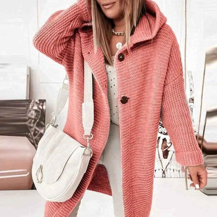 Coral pink chunky knit hooded cardigan featuring button-front longline design