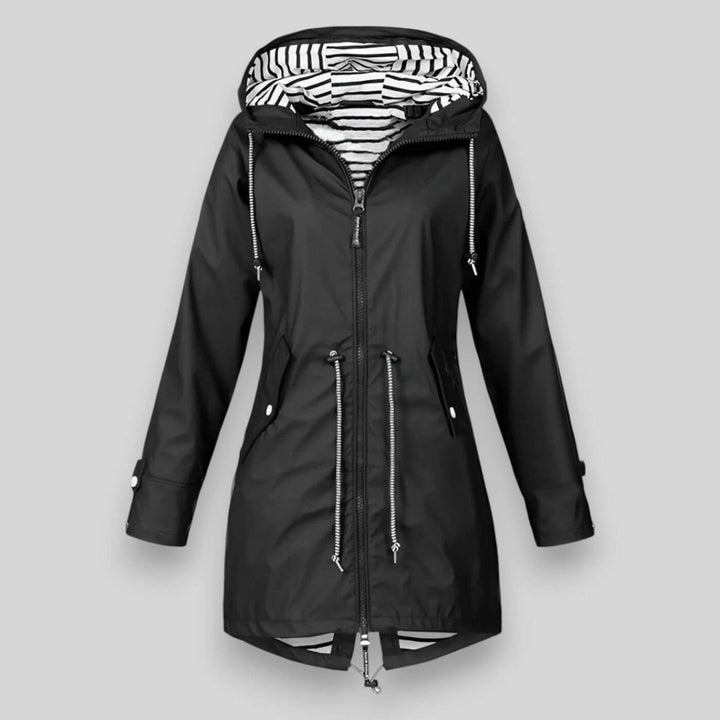 Black hooded rain jacket showing monochrome striped inner lining