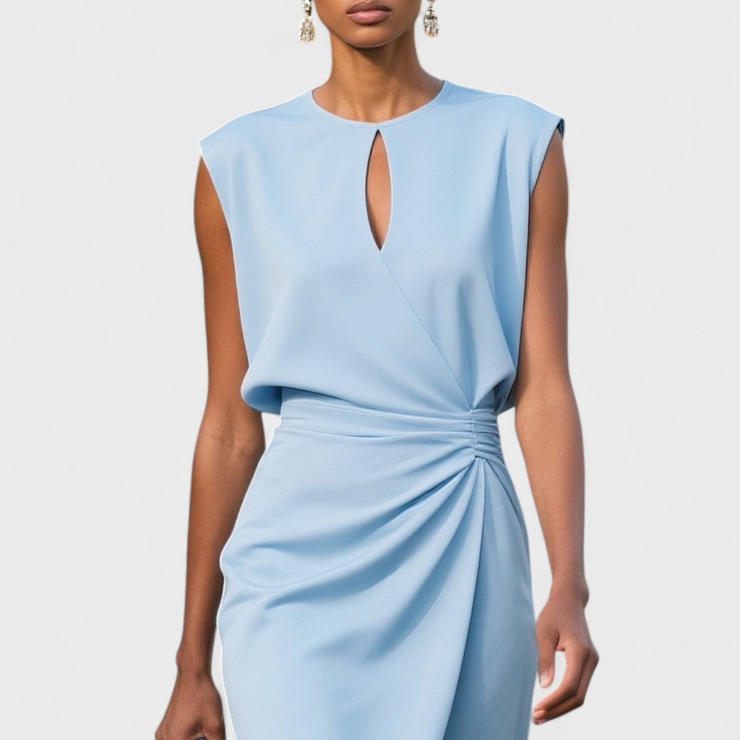 Close-up of pale blue keyhole neckline dress with ruched waist detail
