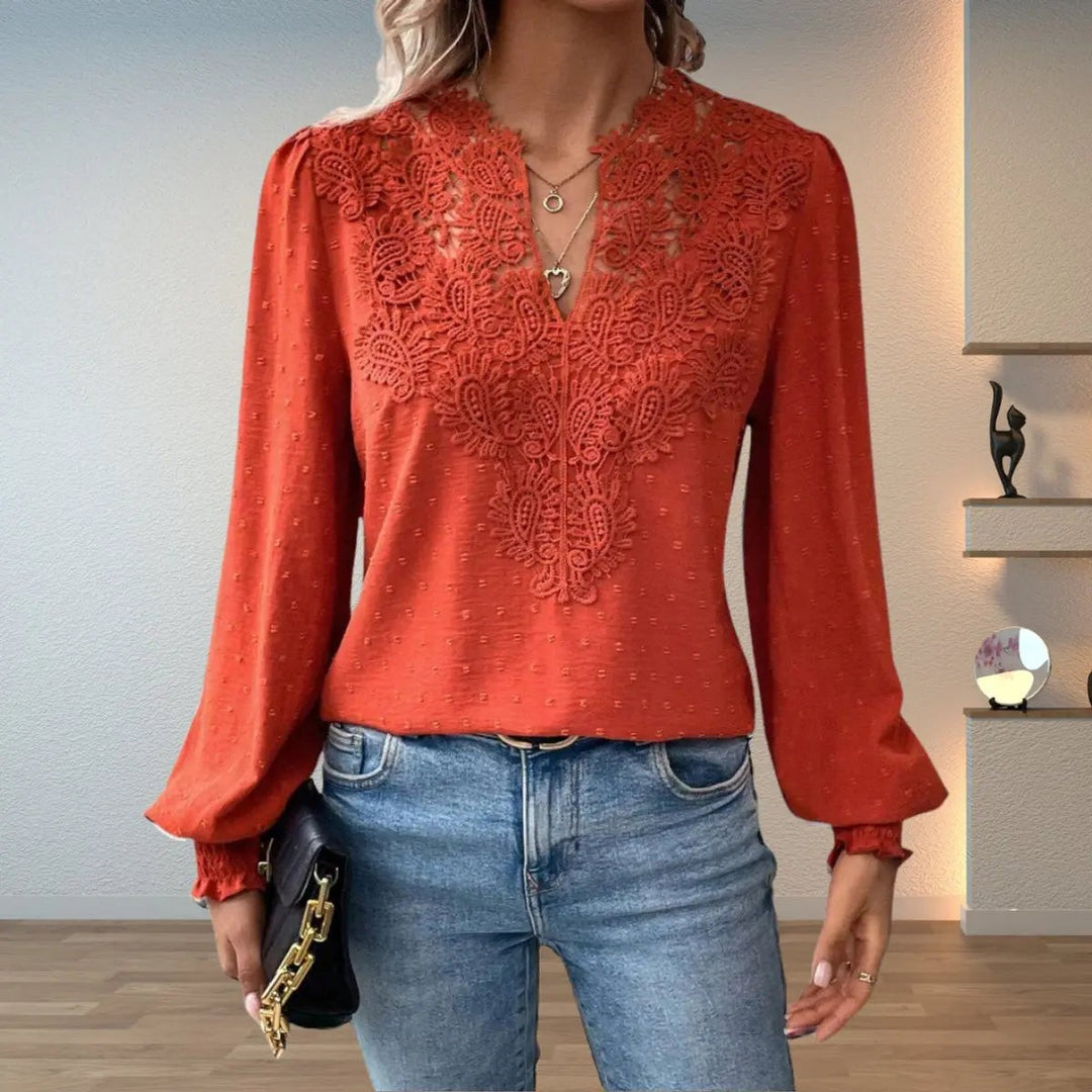 Rust orange lace-trim blouse with V-neck and dotted textured fabric