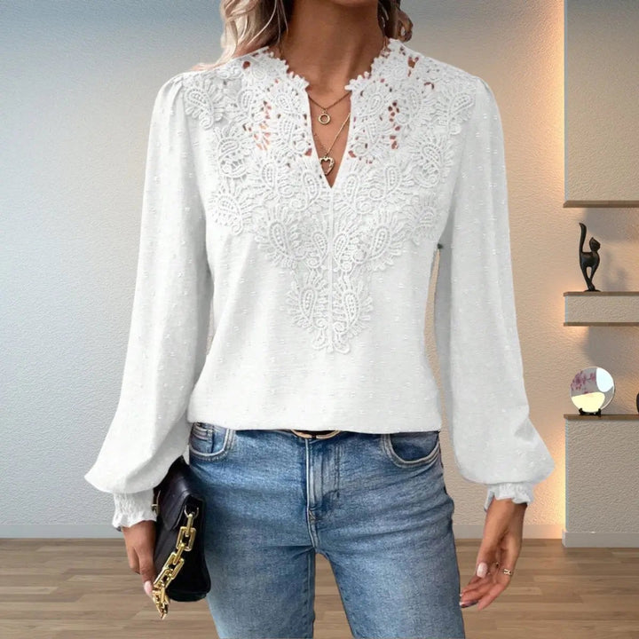 White lace-trim blouse with V-neckline and textured dotted fabric