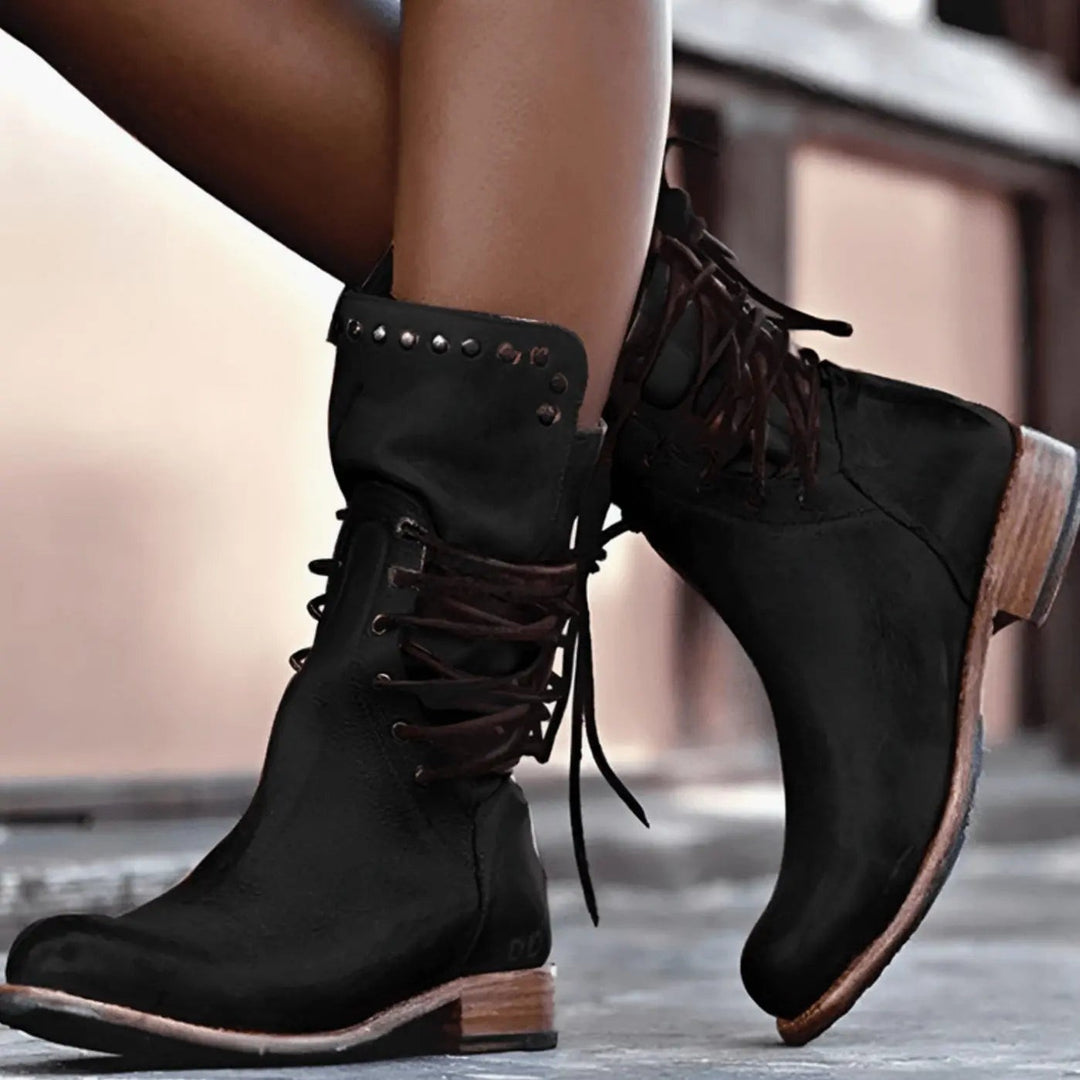 Black leather lace-up mid-calf boots with studded ankle detail and low heel