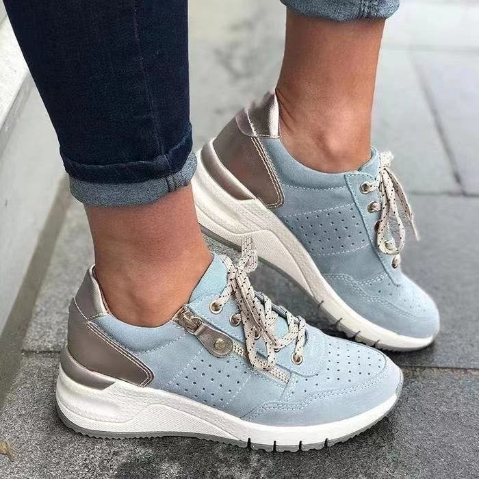 Pale blue suede wedge sneakers with bronze heel panel and laces