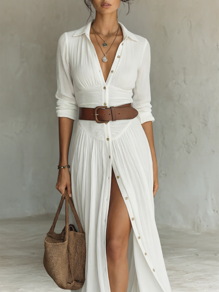 Collared white maxi shirt dress with brown leather belt and long sleeves