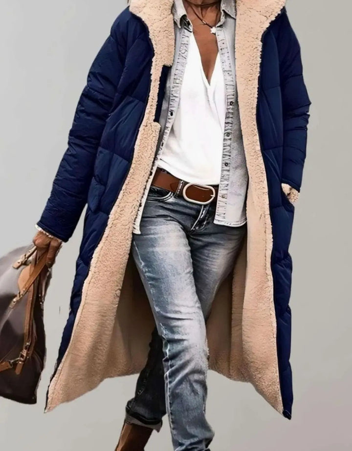 Navy quilted longline coat with hooded cream fleece lining detail