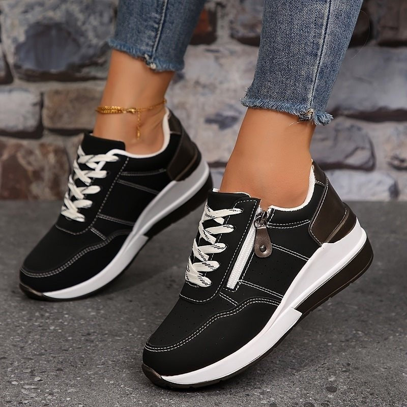 Black lace-up trainers featuring chunky white platform sole