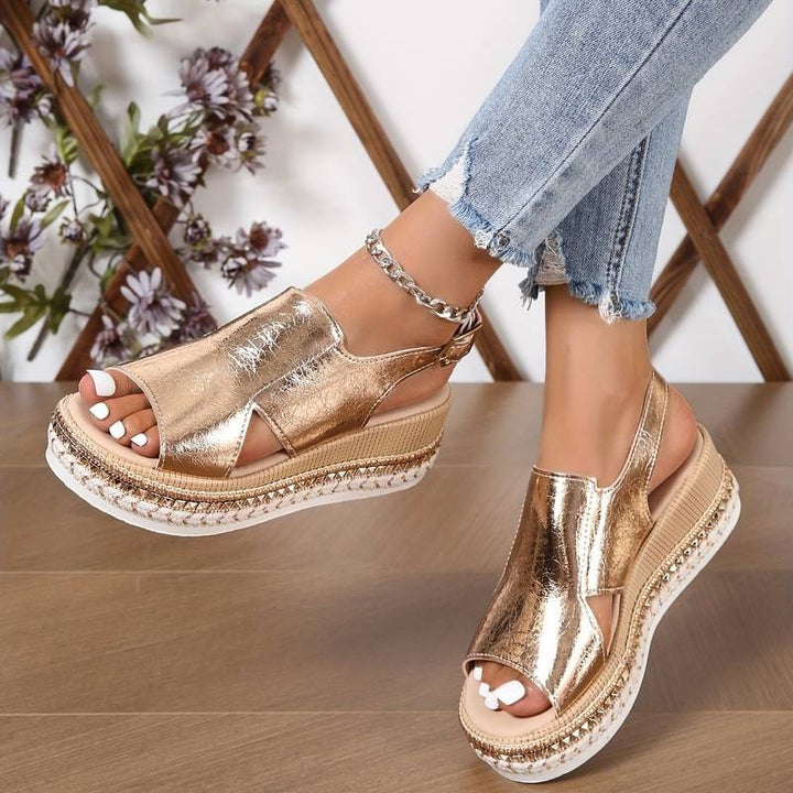 Rose gold platform wedge sandal featuring chunky chain anklet detail