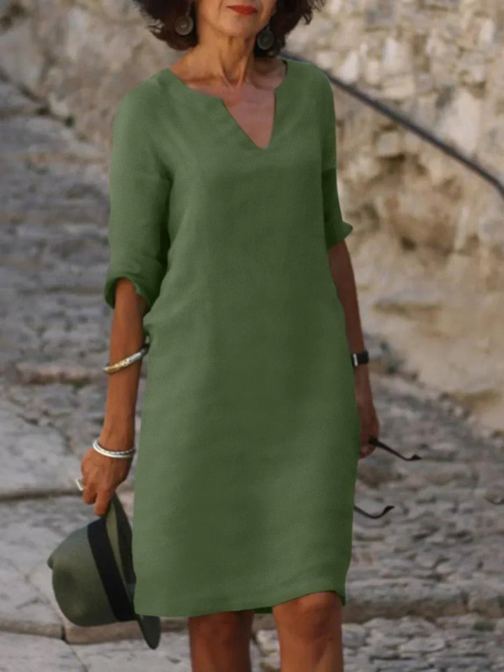 Olive green notch-neck shift dress with mid-length sleeves and relaxed fit
