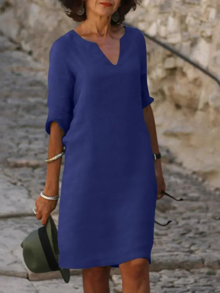 Cobalt blue notch-neck shift dress featuring mid sleeves and a smooth finish